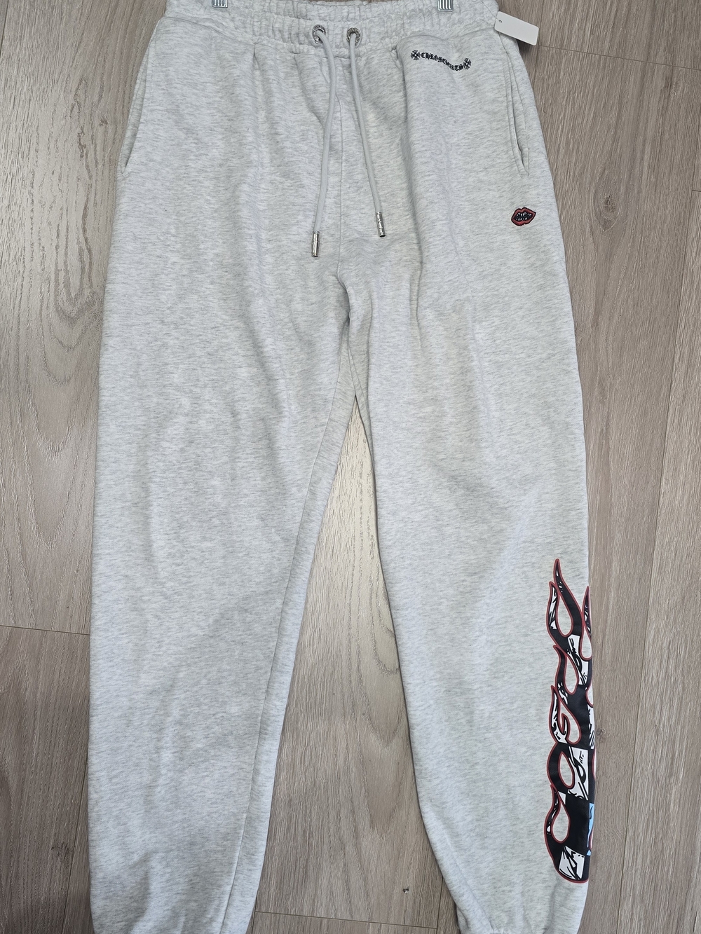 Chrome Hearts Light Gray Joggers with Red & Black Flame Detail